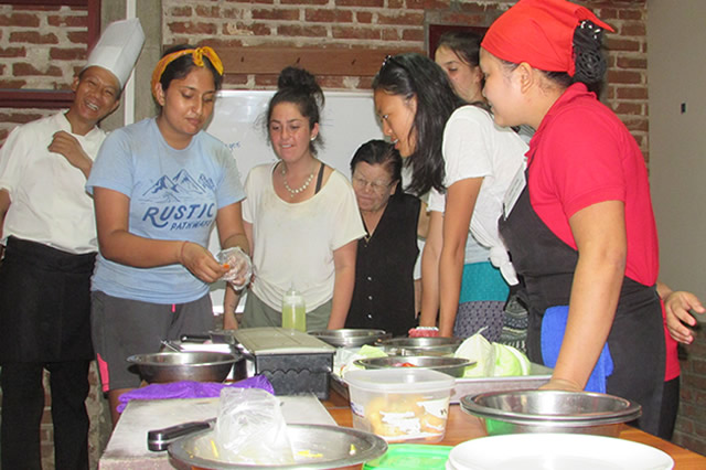 Students from the USA taking a turn to practice kitchen skills